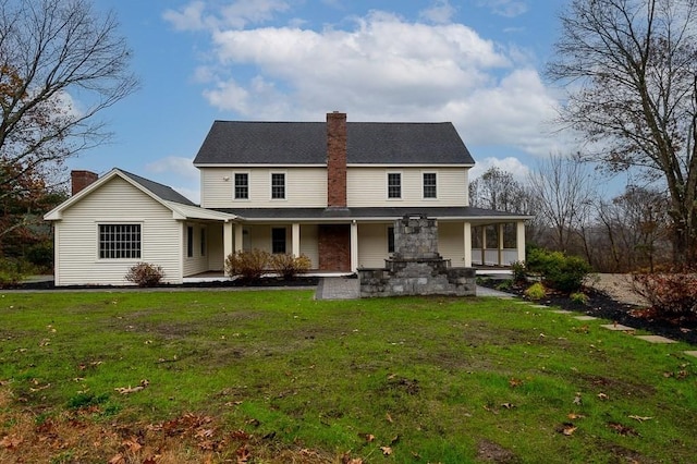 853 Oxford St S, Auburn, MA 01501 - view of front facade with a chimney, covered porch, and a front yard