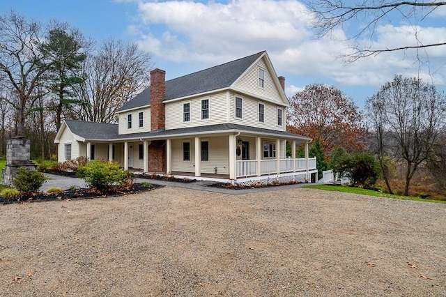 853 Oxford St S, Auburn, MA 01501 - farmhouse inspired home with covered porch, a chimney, gravel driveway, and roof with shingles