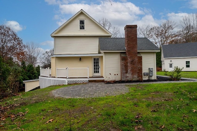 853 Oxford St S, Auburn, MA 01501 - back of house featuring a patio, a lawn, a deck, a chimney, and roof with shingles