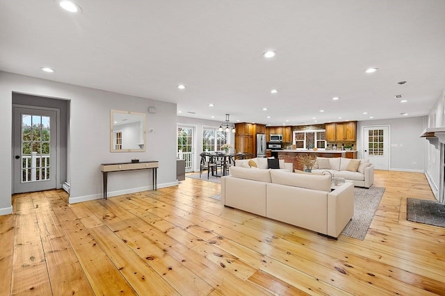 853 Oxford St S, Auburn, MA 01501 - living area with recessed lighting, light wood finished floors, baseboards, and a fireplace