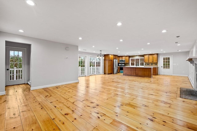 853 Oxford St S, Auburn, MA 01501 - unfurnished living room featuring recessed lighting, light wood-style flooring, baseboards, plenty of natural light, and a fireplace