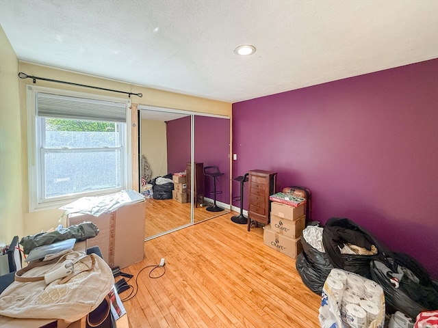 office space featuring hardwood / wood-style flooring and a textured ceiling