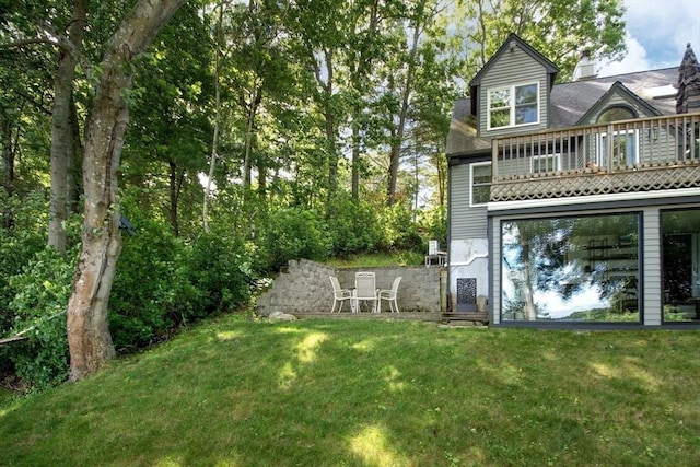 56 Carver St, Pembroke, MA 02359 - rear view of property with a balcony and a yard