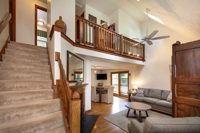 56 Carver St, Pembroke, MA 02359 - living area with wood finished floors, stairs, high vaulted ceiling, and a ceiling fan