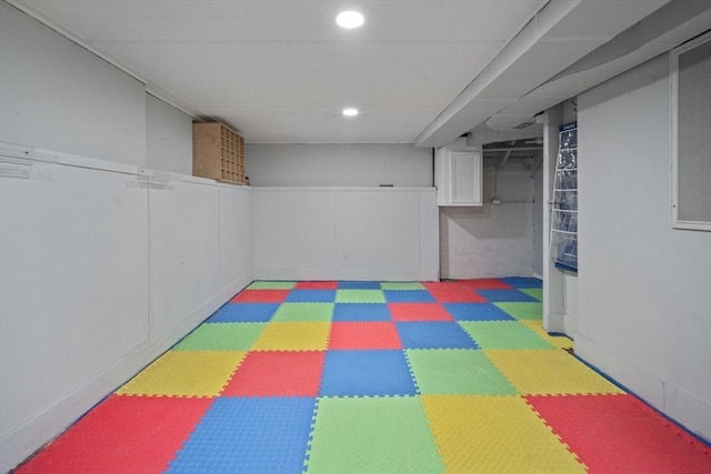 finished basement featuring recessed lighting