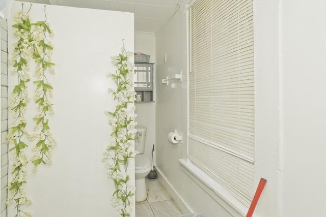 74 Everett St, Springfield, MA 01104 - bathroom featuring baseboards and toilet