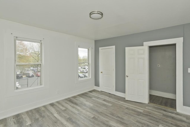 74 Everett St, Springfield, MA 01104 - unfurnished bedroom featuring baseboards and wood finished floors