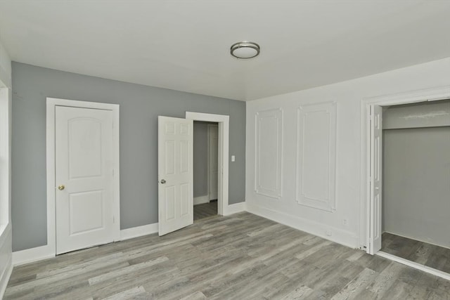 74 Everett St, Springfield, MA 01104 - unfurnished bedroom featuring baseboards and wood finished floors