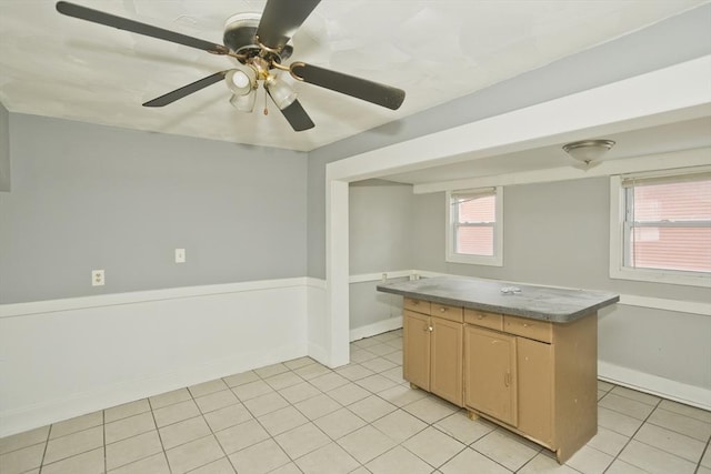 74 Everett St, Springfield, MA 01104 - kitchen with baseboards, light tile patterned floors, and a center island