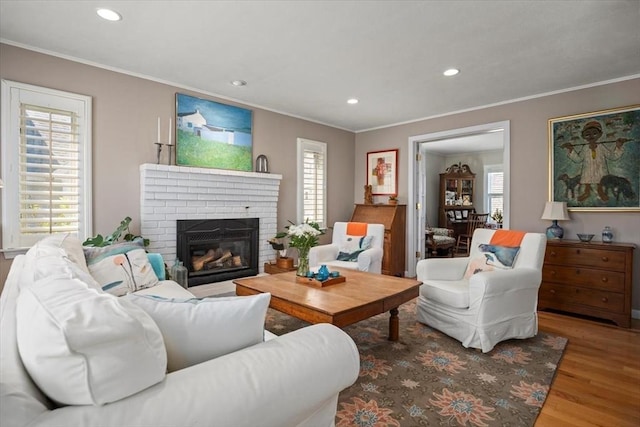 12 14th St, Newbury, MA 01951 - living area featuring wood finished floors, ornamental molding, recessed lighting, and a fireplace