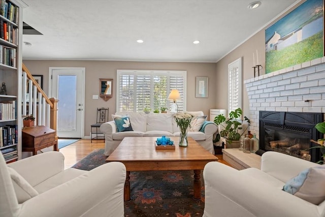12 14th St, Newbury, MA 01951 - living area with wood finished floors, recessed lighting, baseboard heating, and a fireplace