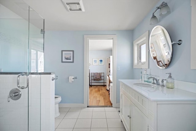 12 14th St, Newbury, MA 01951 - full bathroom with a stall shower, toilet, vanity, tile patterned flooring, and baseboards