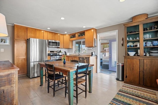 12 14th St, Newbury, MA 01951 - kitchen with appliances with stainless steel finishes, recessed lighting, backsplash, ornamental molding, and light wood-style floors