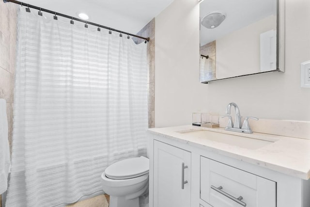 full bath featuring shower / bath combo with shower curtain, toilet, and vanity