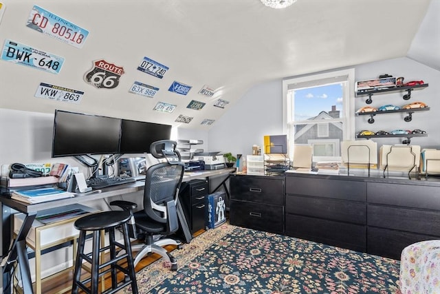 office area with vaulted ceiling