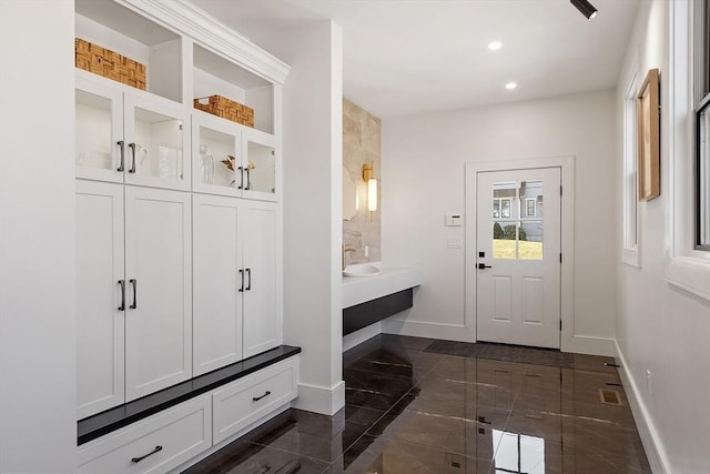 mudroom with visible vents, recessed lighting, baseboards, and marble finish floor