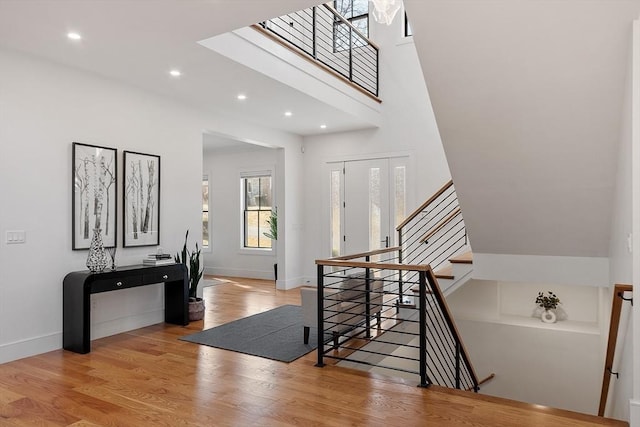 entryway featuring recessed lighting, baseboards, and wood finished floors