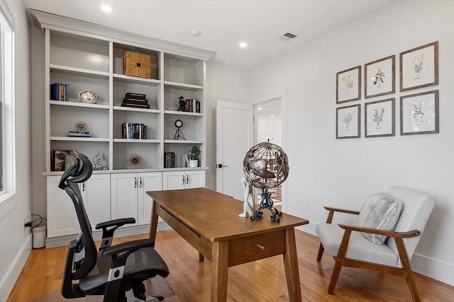 office with visible vents, recessed lighting, baseboards, and light wood-style floors