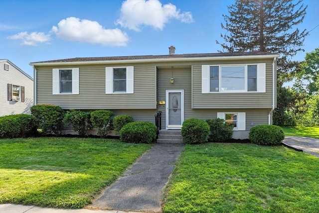 78 Saratoga Ave, Chicopee, MA 01013 - bi-level home with a front lawn and a chimney