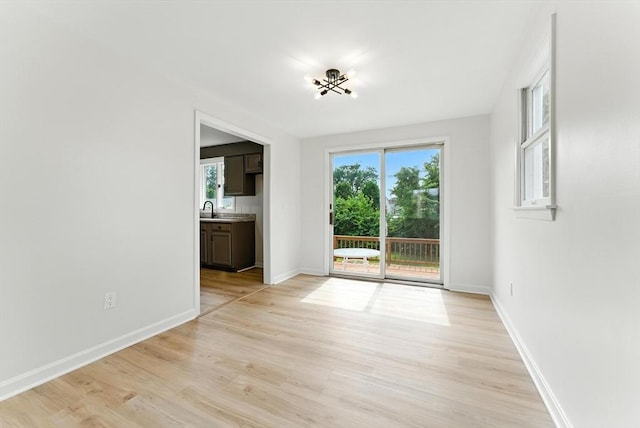 78 Saratoga Ave, Chicopee, MA 01013 - unfurnished room featuring light wood-style floors and plenty of natural light