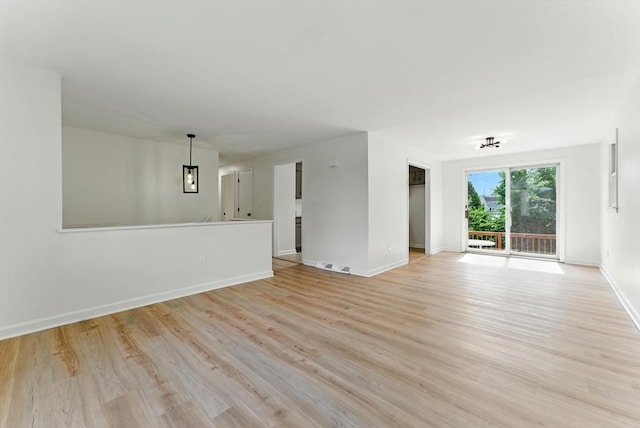 78 Saratoga Ave, Chicopee, MA 01013 - unfurnished living room featuring light wood-style flooring and baseboards