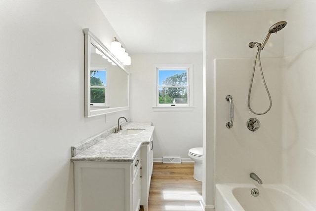 78 Saratoga Ave, Chicopee, MA 01013 - bathroom with vanity, wood finished floors, and washtub / shower combination