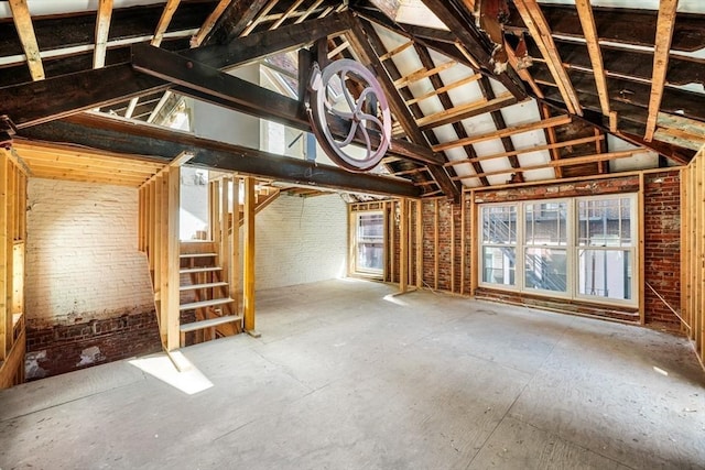 attic featuring stairs