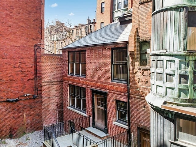 view of home's exterior with brick siding