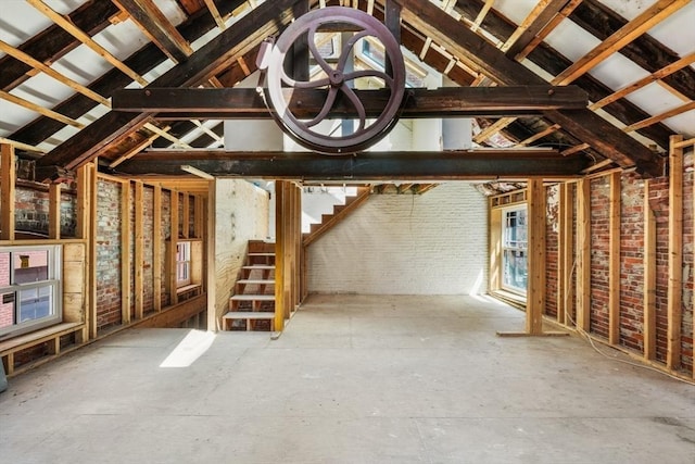 unfurnished living room with vaulted ceiling