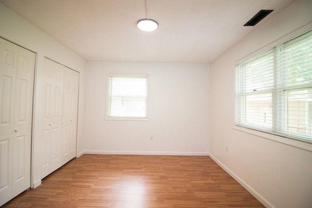 369 Aiken Ave Unit 15, Lowell, MA 01850 - unfurnished bedroom featuring light wood finished floors and baseboards