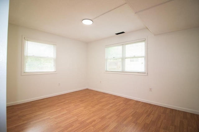 369 Aiken Ave Unit 15, Lowell, MA 01850 - empty room with healthy amount of natural light, light wood-style floors, and baseboards