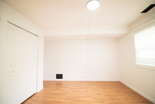 369 Aiken Ave Unit 15, Lowell, MA 01850 - unfurnished bedroom with light wood-style flooring, baseboards, and a closet