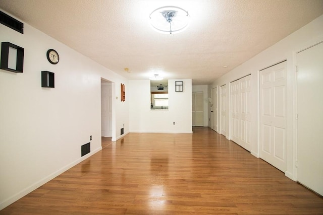 369 Aiken Ave Unit 15, Lowell, MA 01850 - unfurnished living room with light wood-style flooring and baseboards