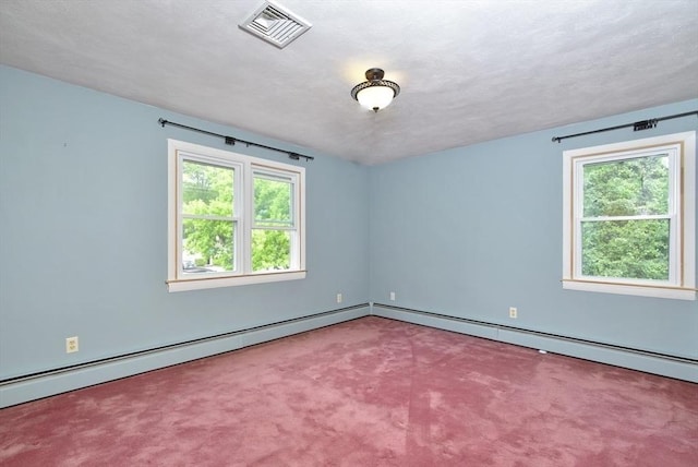 767 S Main St, Bellingham, MA 02019 - carpeted empty room featuring plenty of natural light, a baseboard heating unit, and a textured ceiling