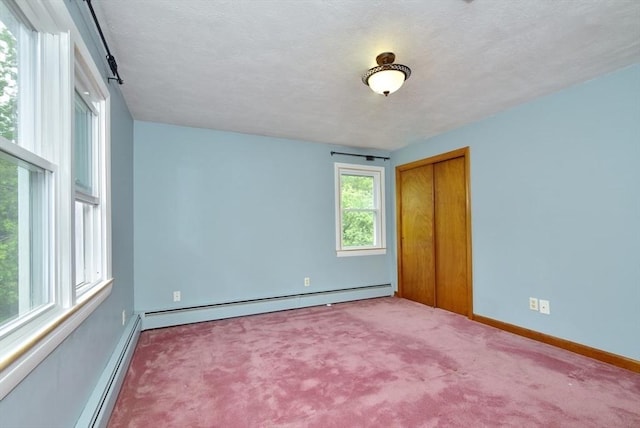 767 S Main St, Bellingham, MA 02019 - unfurnished room featuring carpet floors, baseboard heating, and a textured ceiling