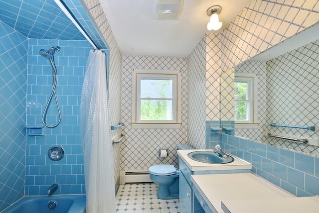 767 S Main St, Bellingham, MA 02019 - bathroom with a baseboard heating unit, vanity, shower / tub combo, tile walls, and tile patterned flooring