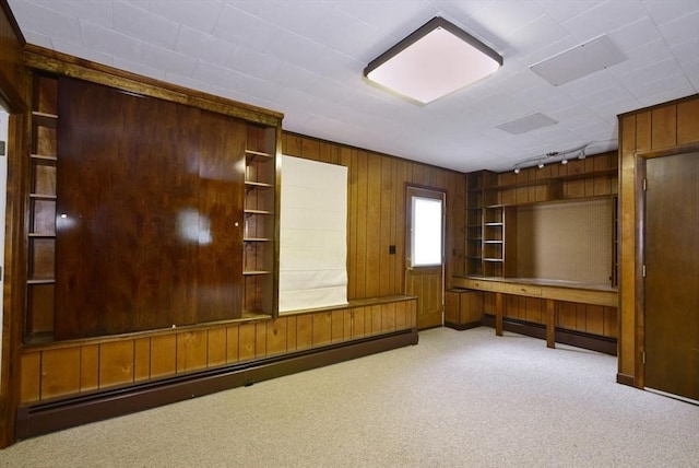 767 S Main St, Bellingham, MA 02019 - unfurnished office featuring baseboard heating, wood walls, and carpet flooring