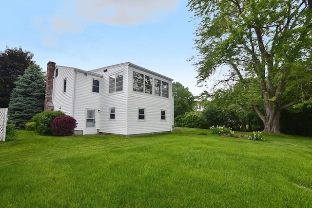 767 S Main St, Bellingham, MA 02019 - back of property featuring a chimney and a lawn