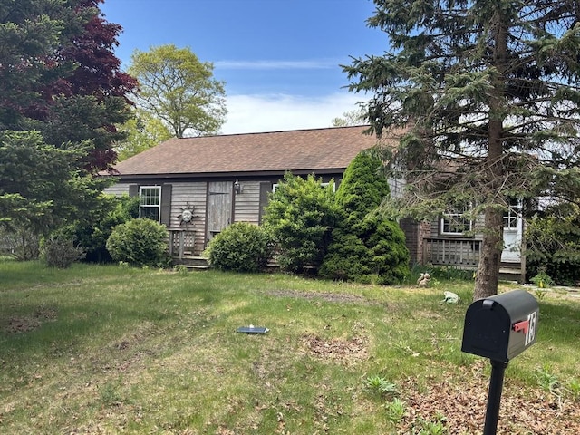 15 Reid Ave, Yarmouth, MA 02673 - view of front of property featuring roof with shingles and a front yard
