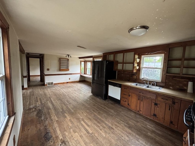 15 Reid Ave, Yarmouth, MA 02673 - kitchen featuring a sink, white dishwasher, wood finished floors, and freestanding refrigerator