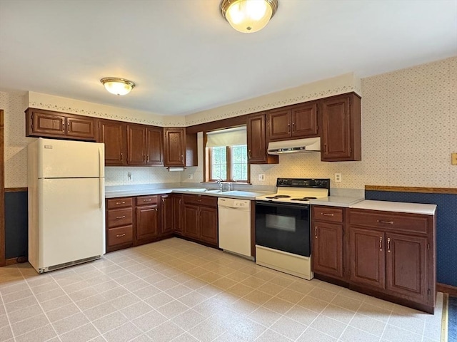 486 Turners Falls Rd, Montague, MA 01351 - kitchen featuring white appliances, wallpapered walls, under cabinet range hood, light countertops, and a sink