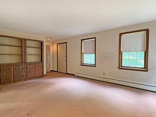 486 Turners Falls Rd, Montague, MA 01351 - empty room with a baseboard heating unit, healthy amount of natural light, and light carpet