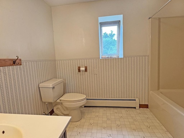 486 Turners Falls Rd, Montague, MA 01351 - full bath with baseboard heating, a wainscoted wall, vanity, toilet, and tile patterned floors