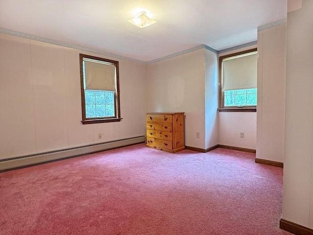 486 Turners Falls Rd, Montague, MA 01351 - empty room featuring plenty of natural light, a baseboard heating unit, carpet floors, baseboards, and ornamental molding