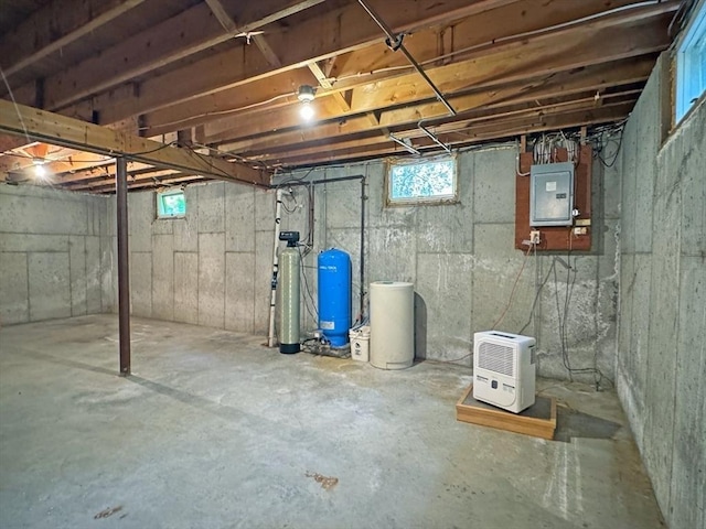 486 Turners Falls Rd, Montague, MA 01351 - basement featuring electric panel, a water pressure tank, a water softener system, and healthy amount of natural light