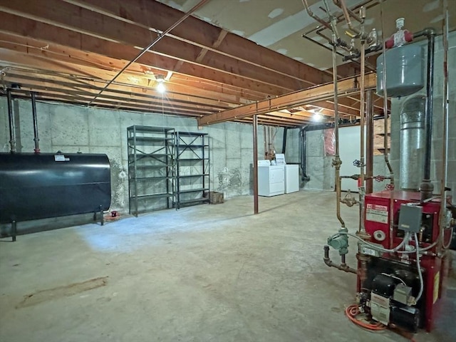 486 Turners Falls Rd, Montague, MA 01351 - unfinished basement with oil tank, washing machine and dryer, and a heating unit