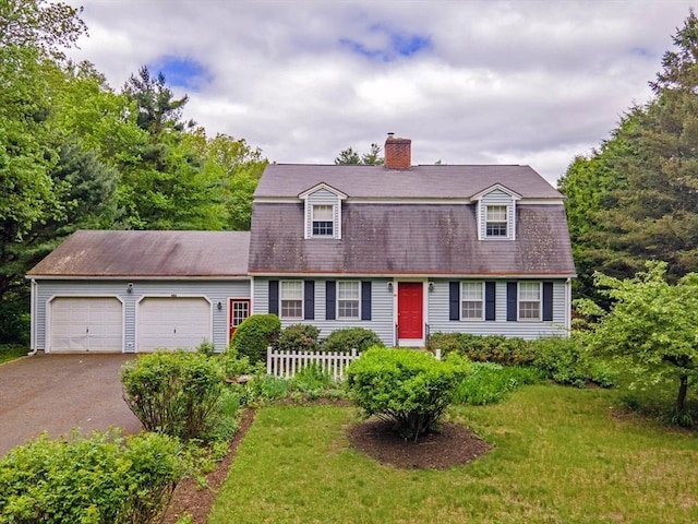 486 Turners Falls Rd, Montague, MA 01351 - colonial inspired home featuring driveway, a garage, and a chimney