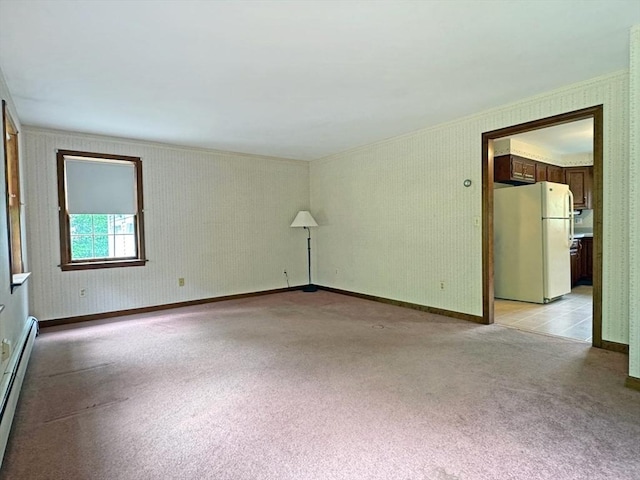 486 Turners Falls Rd, Montague, MA 01351 - empty room with crown molding, light carpet, baseboard heating, and baseboards