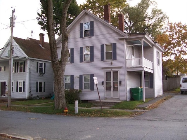 19 Chestnut, Winchendon, MA 01475 - view of front of house with a chimney and a balcony