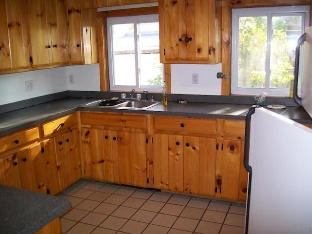 19 Chestnut, Winchendon, MA 01475 - kitchen featuring refrigerator, a sink, dark countertops, and light tile patterned floors